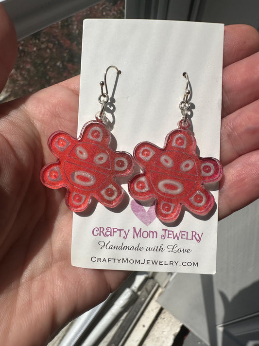 Colorful Taino sol symbol acrylic earrings