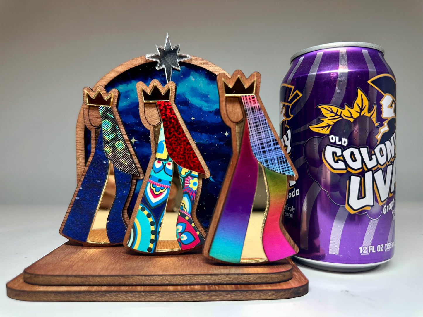 Mahogany kings with colorful robes in front of a night sky, tres Reyes shelf sitter